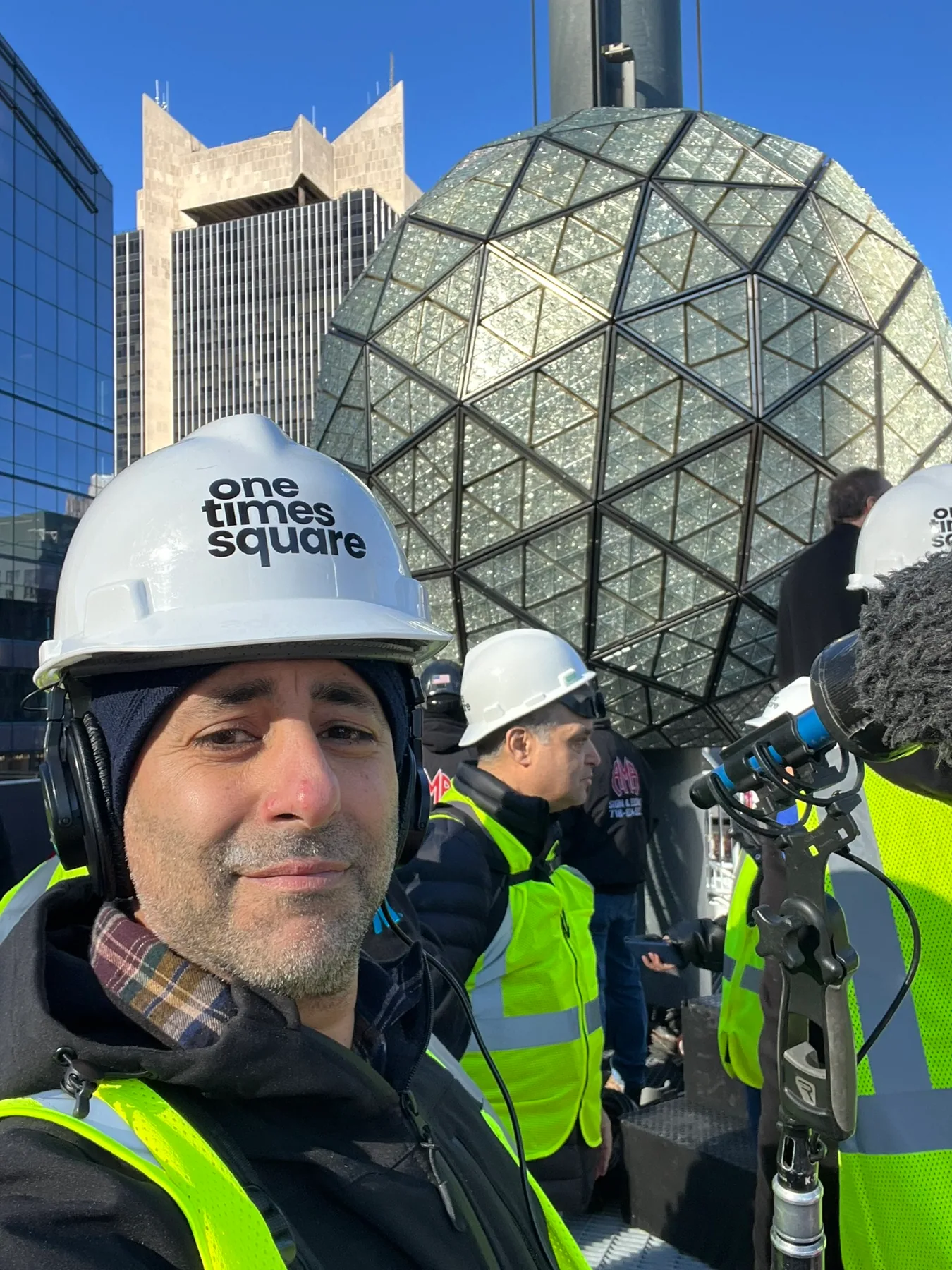 Matthew Legreca in safety gear with boom and camera team at a city exterior shoot