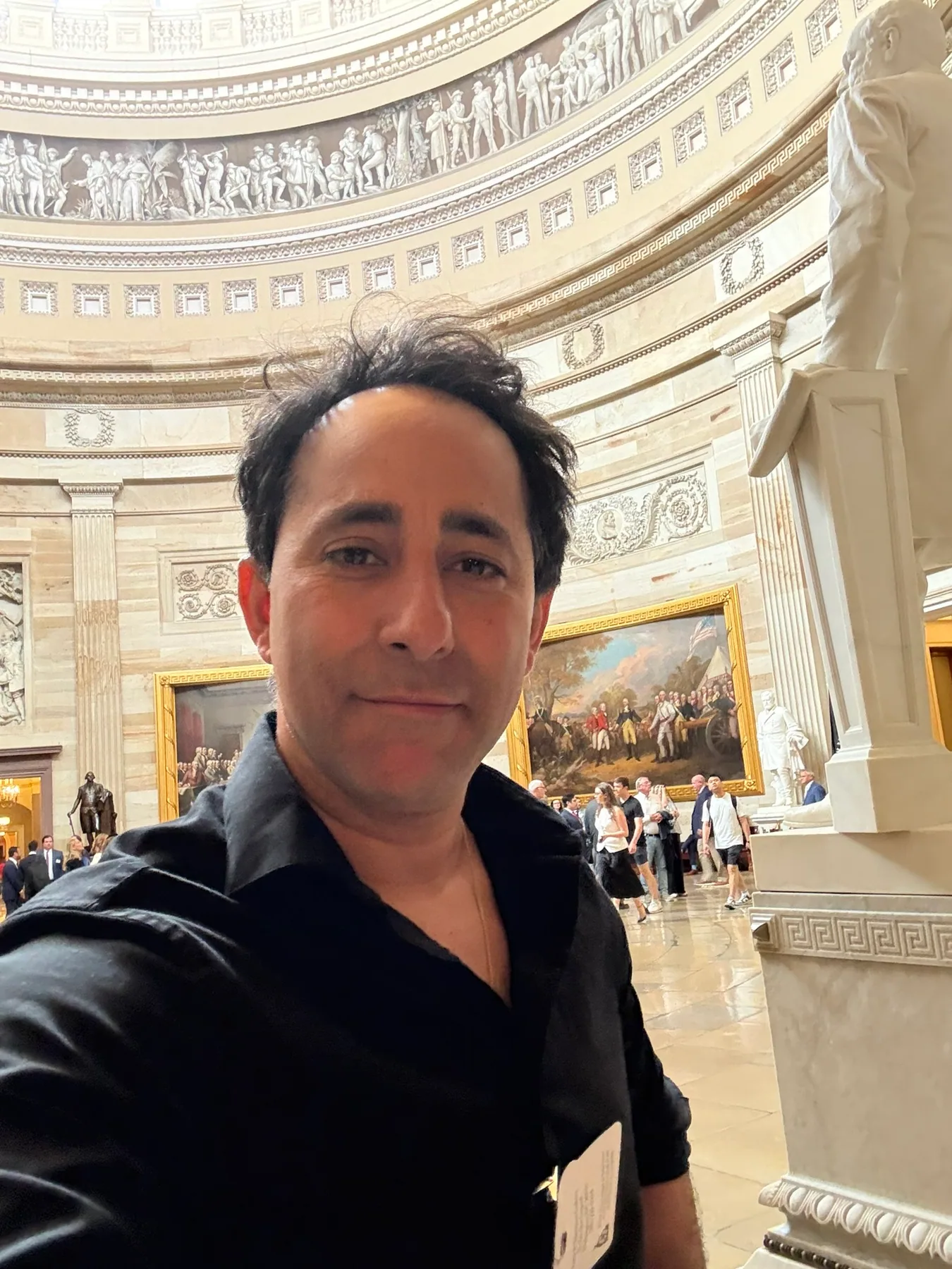 Matthew Legreca photographed inside a government building during production work