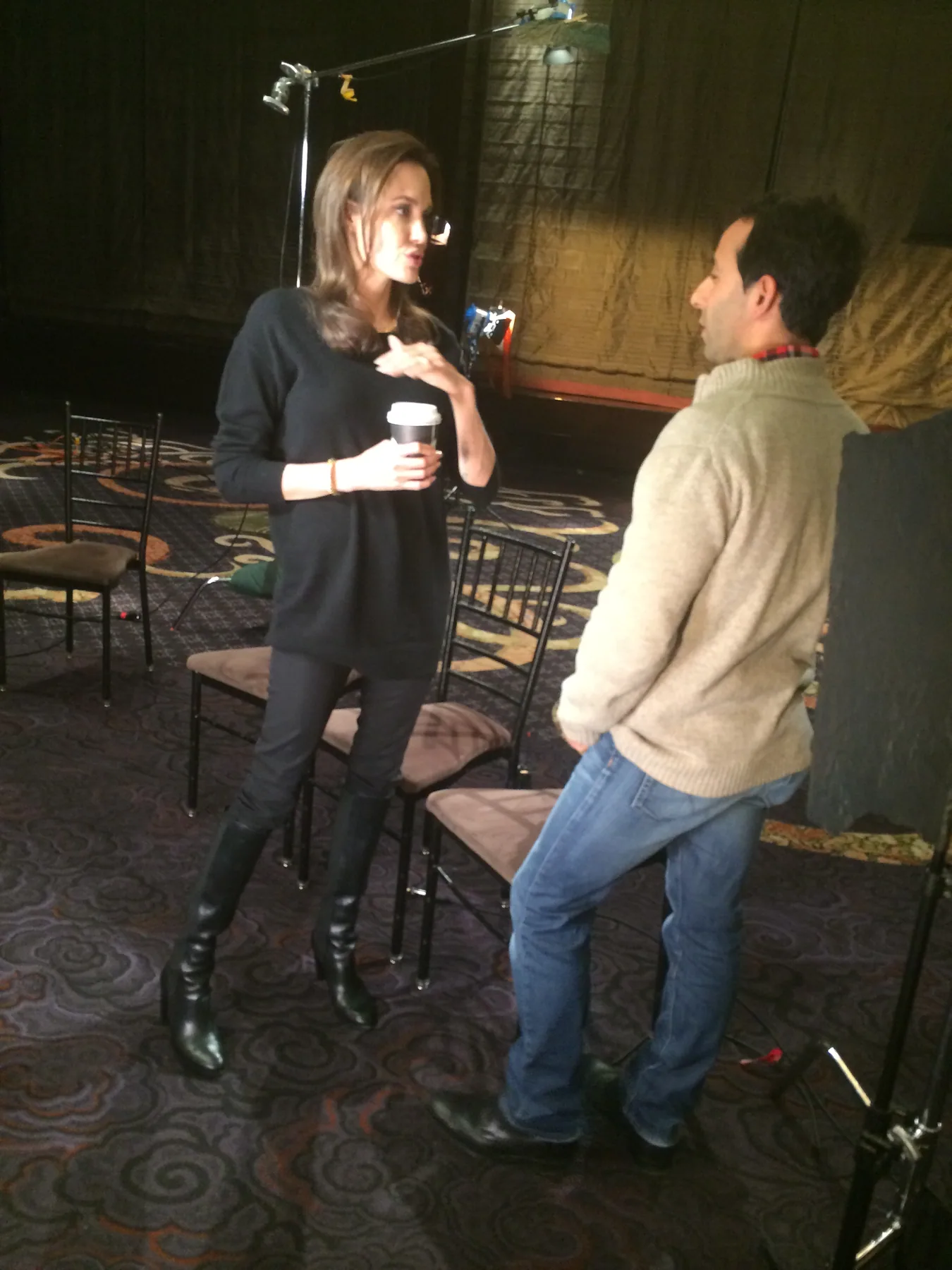 Interview setup on a stage with Matthew Legreca and a seated on-camera subject